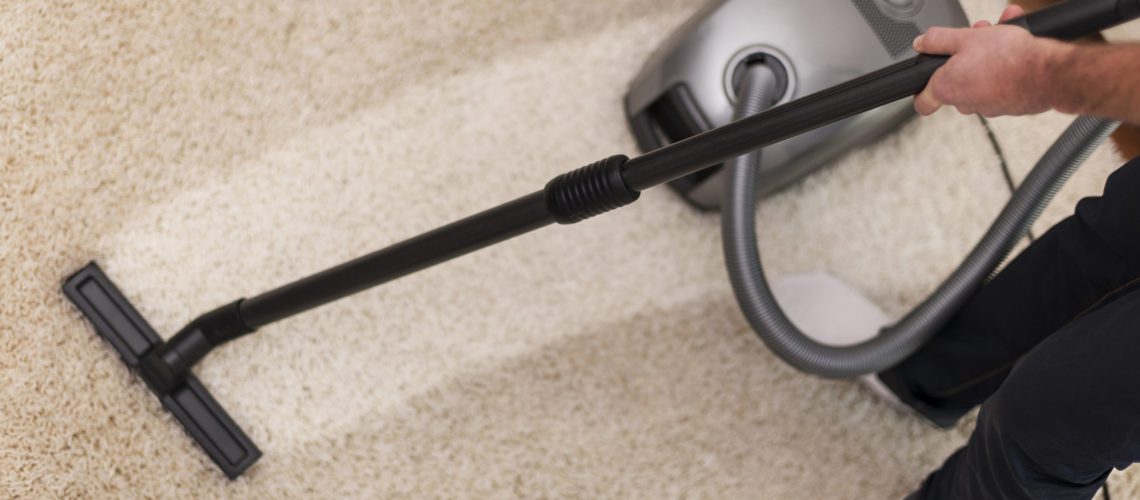 Close up of vacuuming a carpet